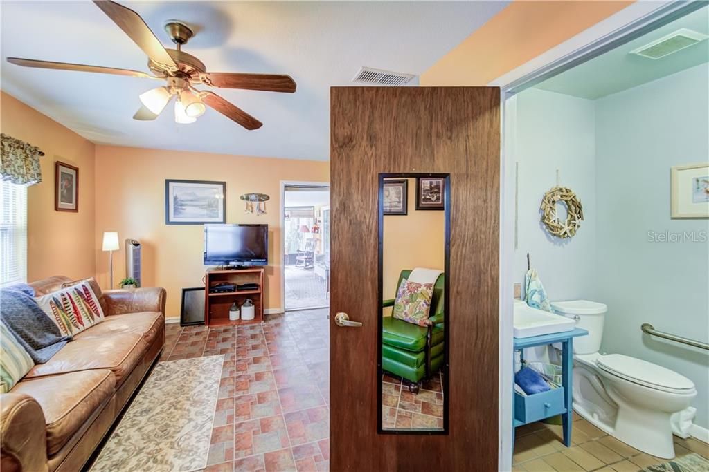 MOTHER-IN-LAW SUITE (BEDROOM 4 / BATHROOM 3) WITH HANDICAP ACCESSIBLE SHOWER AND EXIT DOOR - CURRENTLY UTILIZED AS A FAMILY ROOM