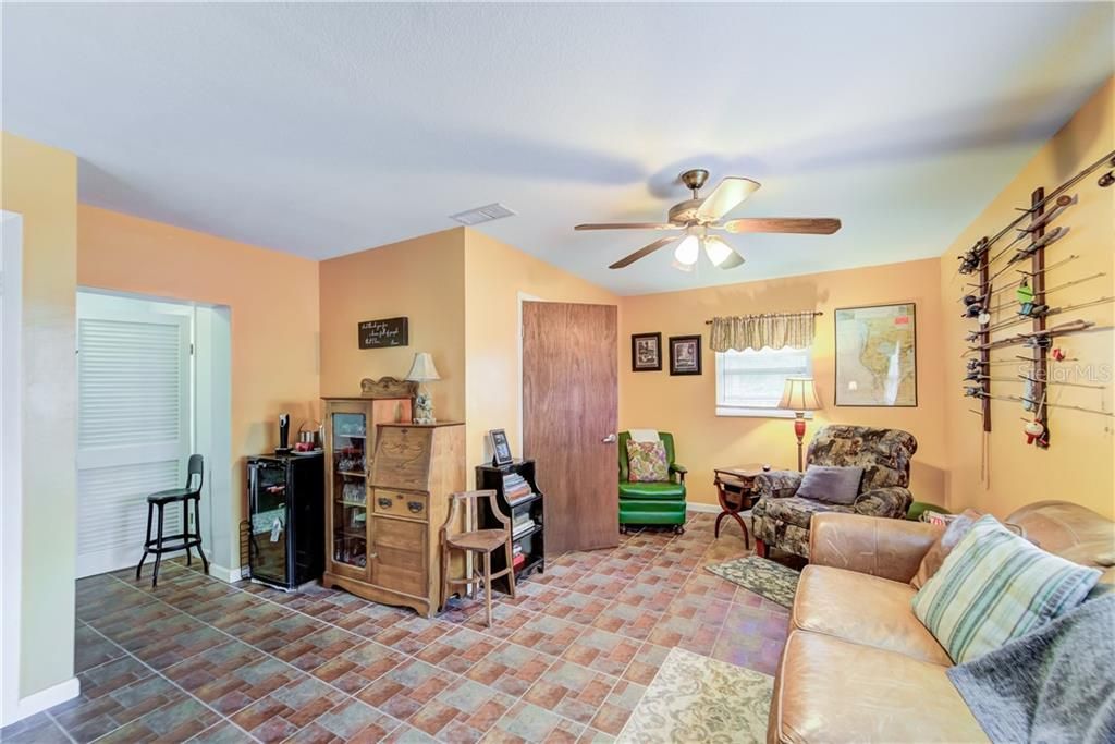 MOTHER-IN-LAW SUITE (BEDROOM 4 / BATHROOM 3) WITH HANDICAP ACCESSIBLE SHOWER AND EXIT DOOR - CURRENTLY UTILIZED AS A FAMILY ROOM