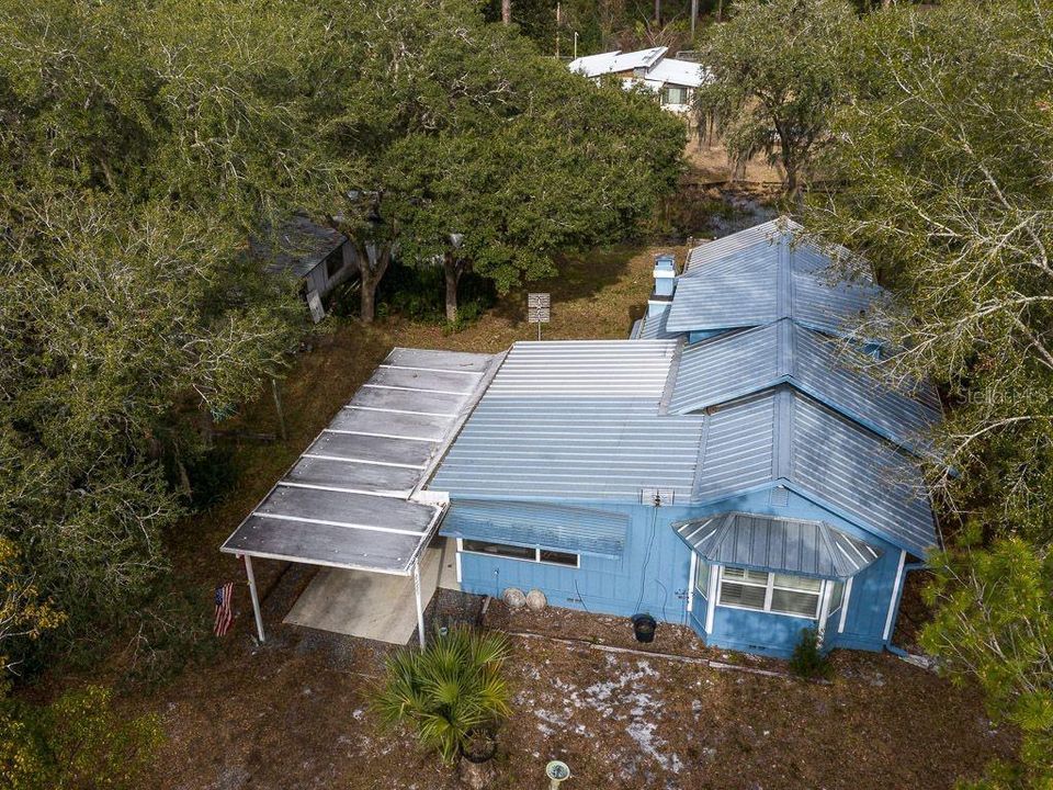 25925 Blue Lakes Dr, Paisley, FL 32767. Look at that metal roof!