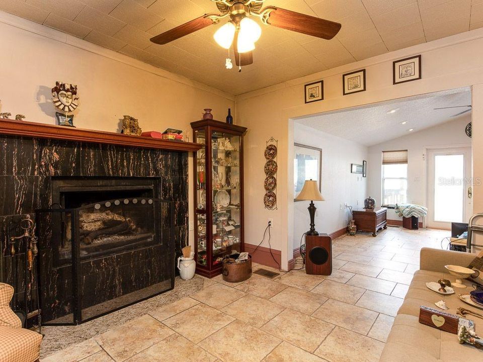 25925 Blue Lakes Dr, Paisley, FL 32767. Dining Room, beautiful fireplace.