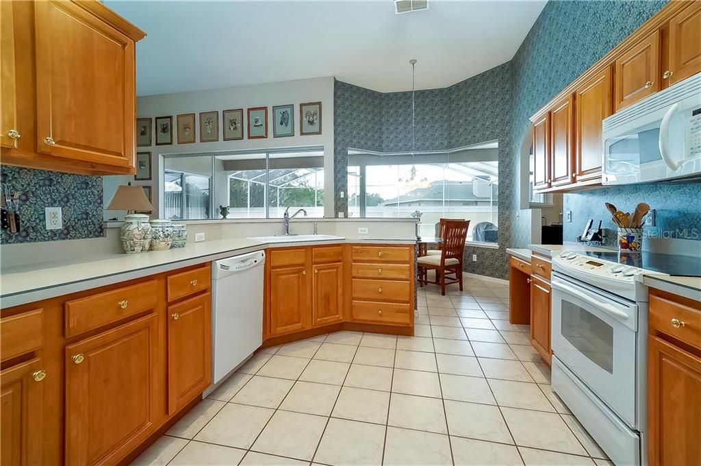 The kitchen overlooks the family room and boasts plenty of cabinet and counter space as well as a breakfast bar.