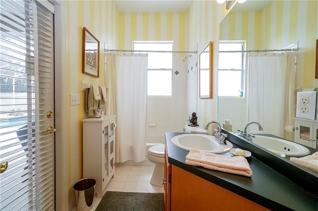 Full bath with access to the pool.