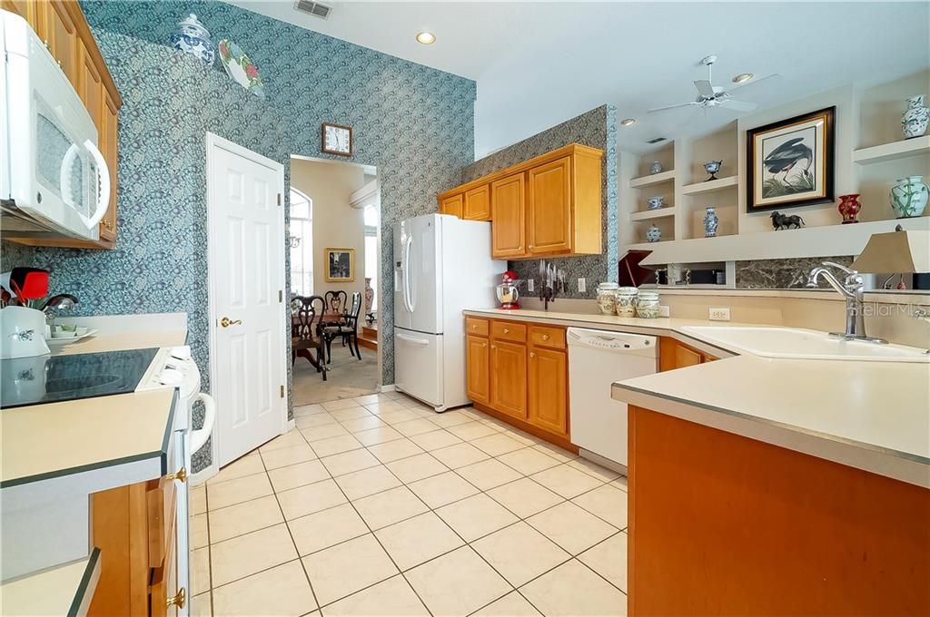 The kitchen overlooks the family room and boasts plenty of cabinet and counter space as well as a breakfast bar.