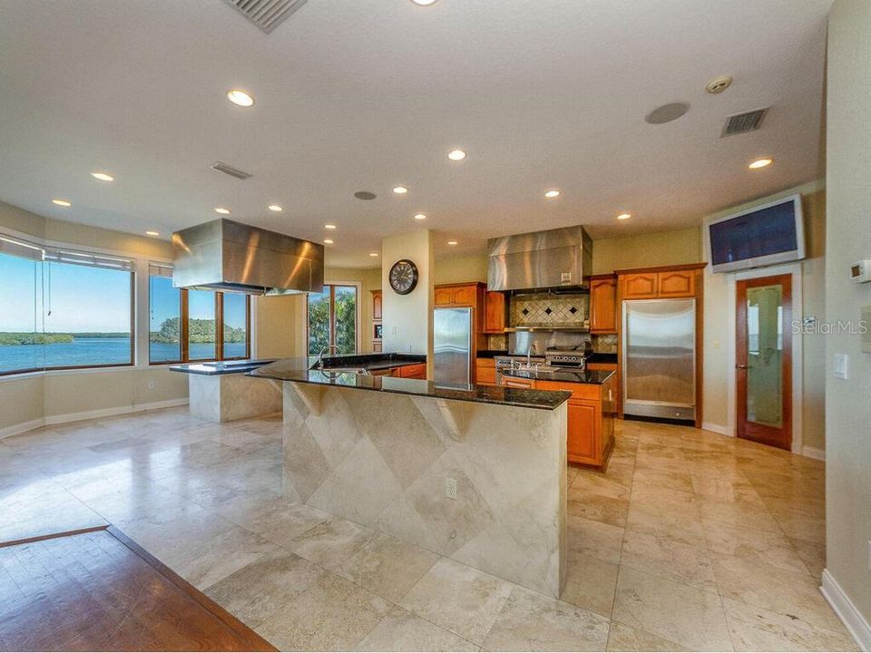 GORGEOUS KITCHEN WITH 2 COOKING AREAS COMMERCIAL COOKSTATION ON NATURAL GAS AND A HABACHISTYLE COOKSTATION BOTH OVERLOOKING THE OPEN WATER.