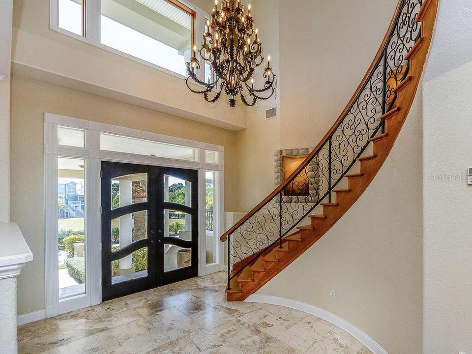 ELEGANT WOOD STAIRCASE TO THIRD LEVEL OF HOME OR TAKE THE NEARBY ELEVATOR FOR ACCESS TO FLOORS 1.2 AND 3.