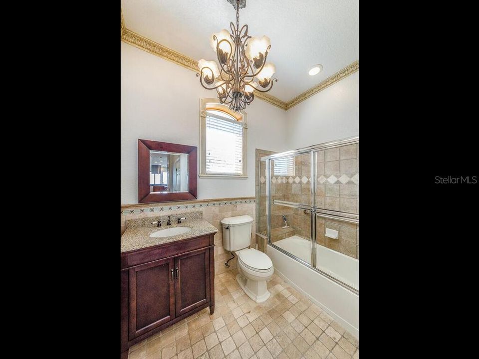 GUEST BATH LOCATED NEAR KITCHEN DINING AND GREATROOM