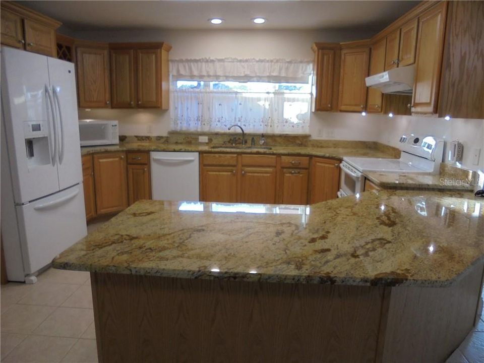 Spacious kitchen with generous cabinet space.