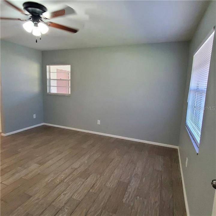Bright living area with ceiling fan