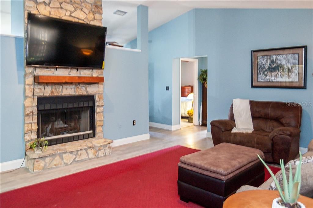 Light, bright Great Room with wood burning fire place. Great for comfy and cozy evenings.
