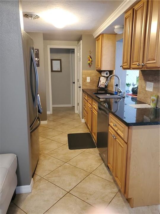 Pass-through over the sink out to the wine bar and Florida room.