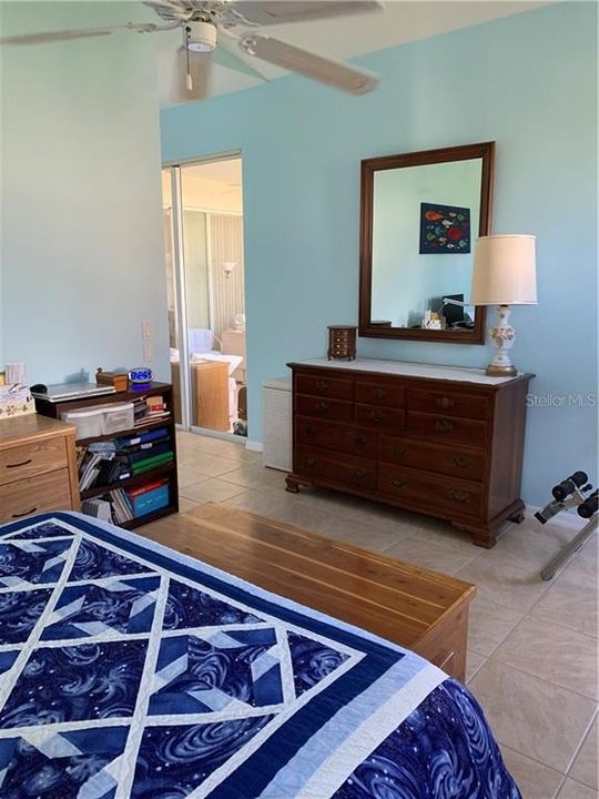 Master bedroom showing slider to FL room