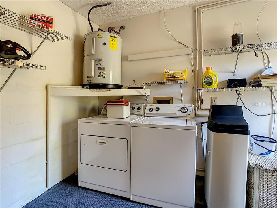 Garage with Washer and Dryer, Water Softener and hot water heater.