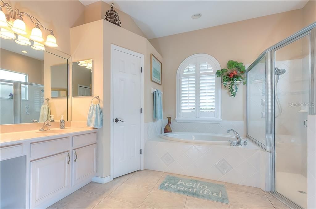 Ensuite Master bath features dual separate sinks, water closet, garden tub, walk-in shower & linen closet!