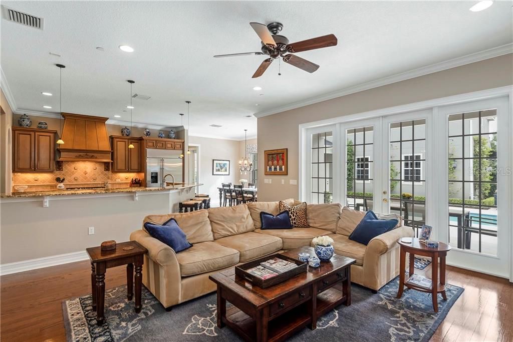 Open Floor plan with kitchen overlooking family room and pool and spa