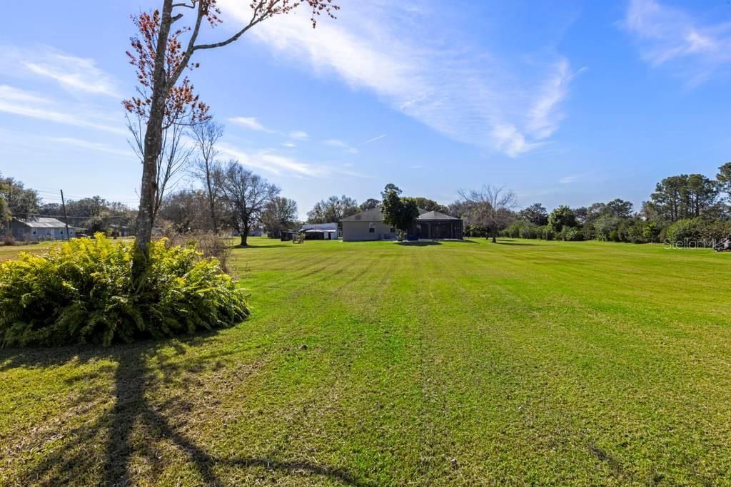 Backyard view from lake to house