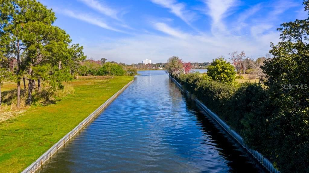 Canal leading to Lake May - subject property is along the right side of canal bordered by privacy hedge, and numerous fruit trees including mango, various citrus, and Mulberry.