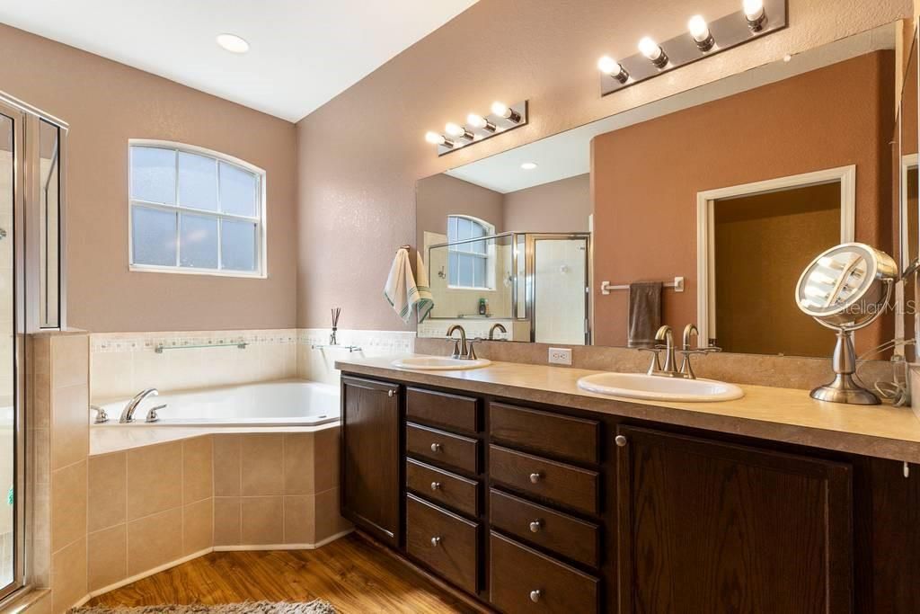 Master Bathroom with garden tub, separate shower, and 2 sinks