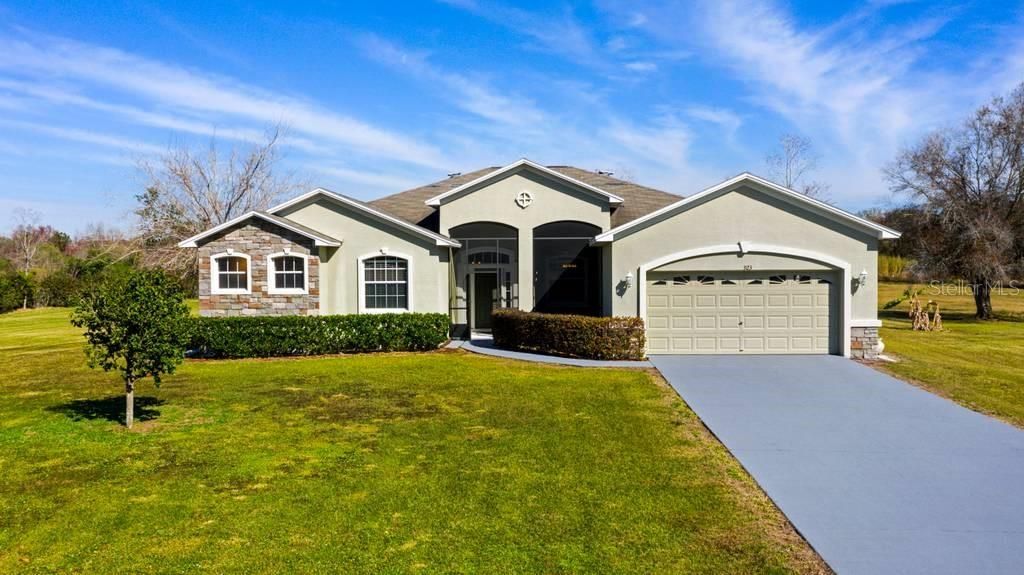 Front Elevation, 2 car garage, screened entry way.