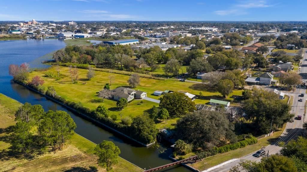 View from Ave N SW (at bottom), canal on west side of property and up to Lake May