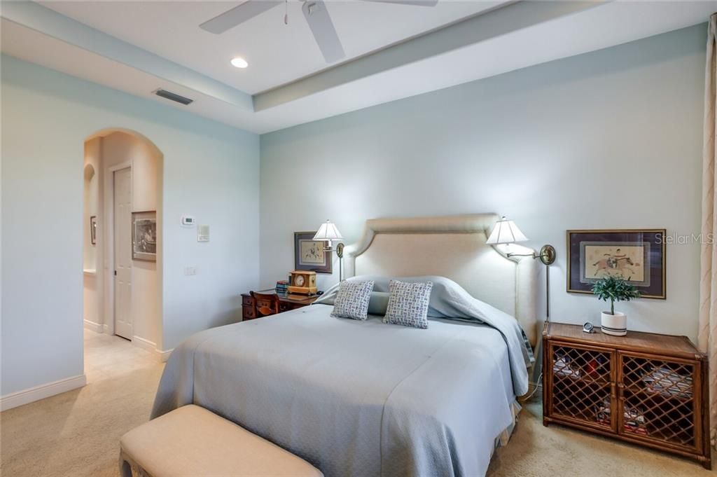 Master bedroom with tray ceiling.