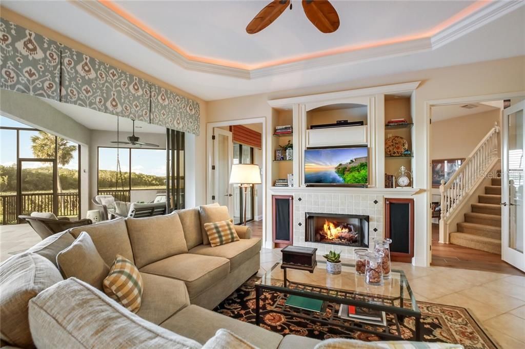 Family room with gas fireplace, pocket sliders leading to the pool.