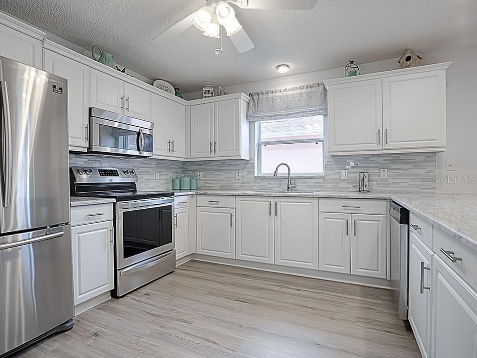 COMPLETELY RENOVATED KITCHEN WITH GRANITE, STAINLESS, AND BACKSPLASH