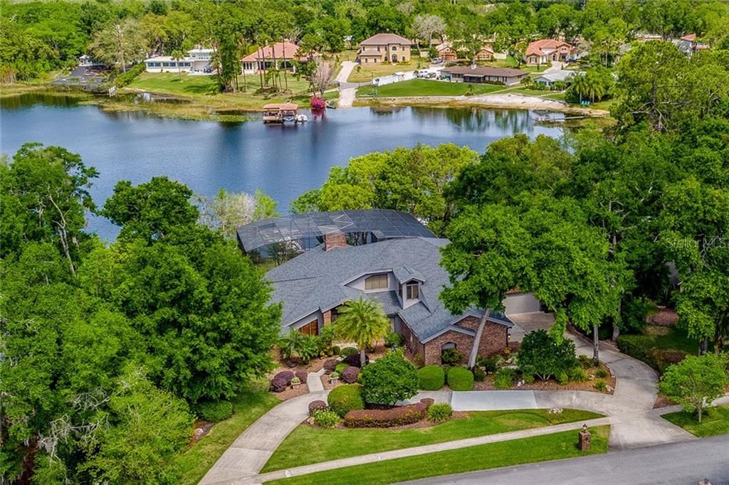 Space, privacy and a CUSTOM BUILT POOL HOME designed by Robert DeLorenzo on SKIABLE LAKE MARY is ready and waiting for you to fall in love and experience the idyllic Florida lake lifestyle!