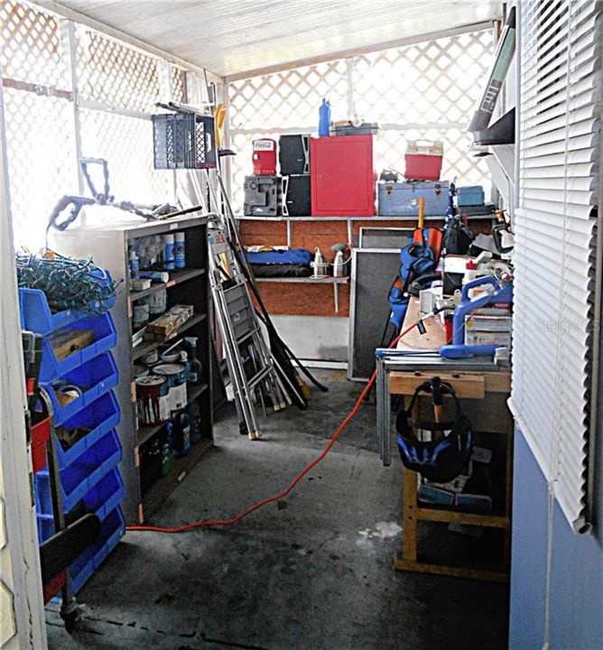 Enclosed extra room- can be used for tools, art room, laundry or more!
