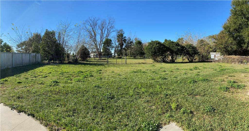 Large fenced backyard extends through the gate for a total of 1/2 acre of land