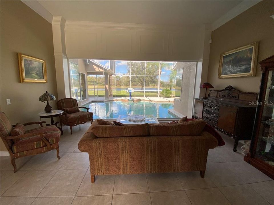 Front Entry sitting room with pool view and custom woodworking