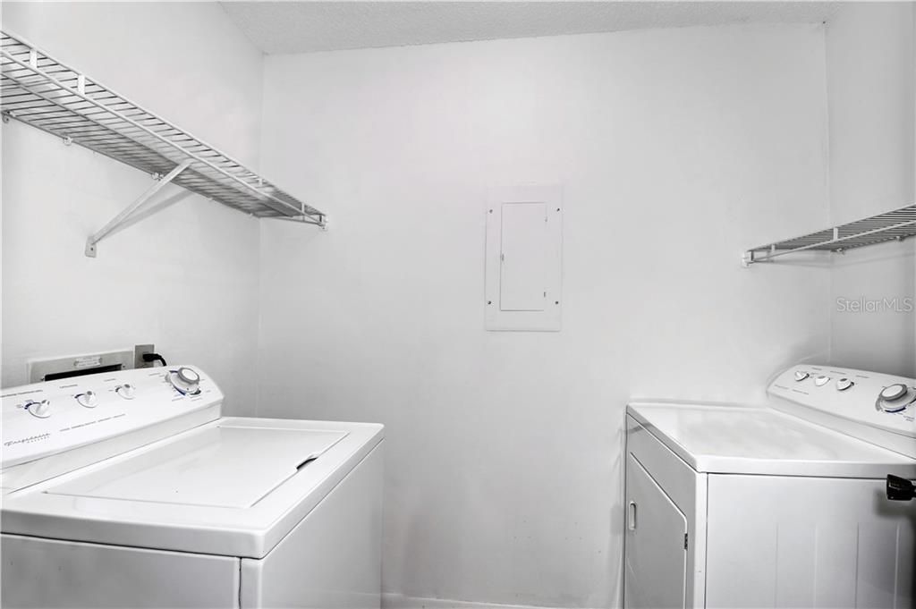 Laundry room with full size washer and dryer.