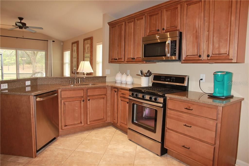 Quartz Counters, Custom Wood Cabinets, Newer Stainless Appliances