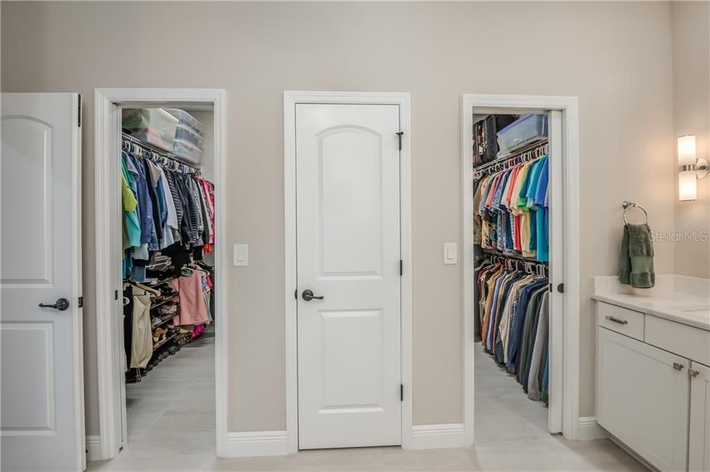 Double walk in closets and separate linen closet.