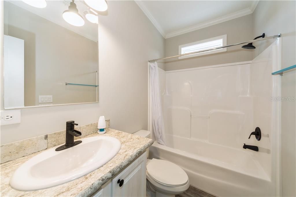 Hall Bath, has separate Linen Tower, and designer Fixtures!