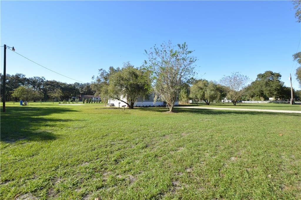 1 ACRE - Loads of Room, Home is Centrally Located on Lot