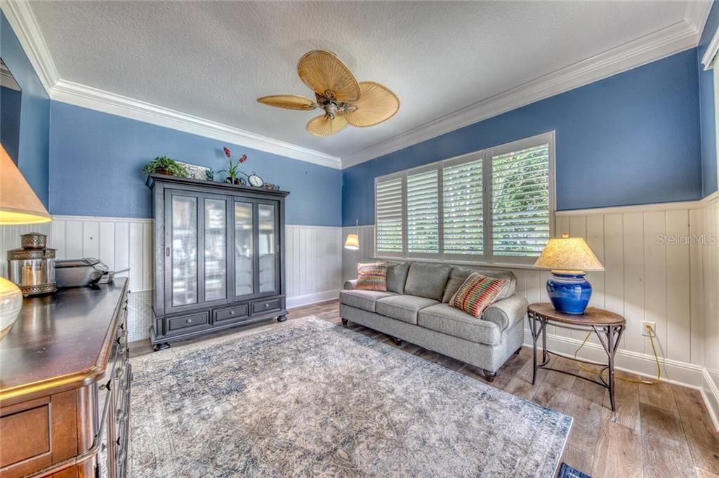 BONUS ROOM-Renovated flooring, plantation shutters, hurricane proof windows and sliders out to the lanai