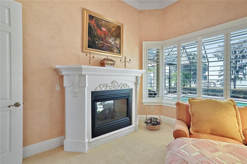 Relax at the 2-sided gas fireplace to the lanai.