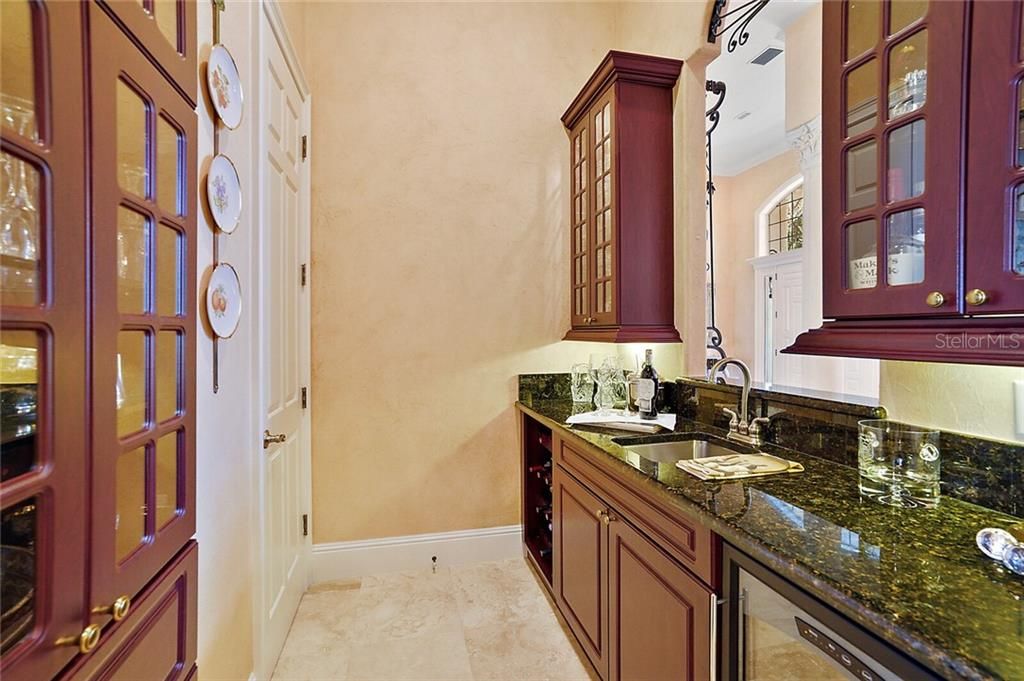 Butler???s pantry with sink and wine refrigerator