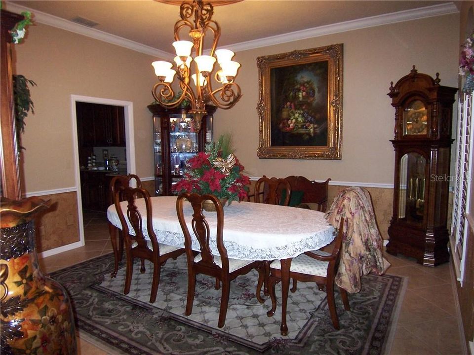FORMAL DINING ROOM with pocket door to close off Kitchen when entertaining. 20 inch imported Tosca Ivory Porcelain Flooring