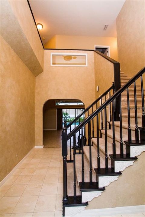 FOYER with Marble Floors. Forming Living Room to the Left-Formal Dining to the right with Family Room straight.