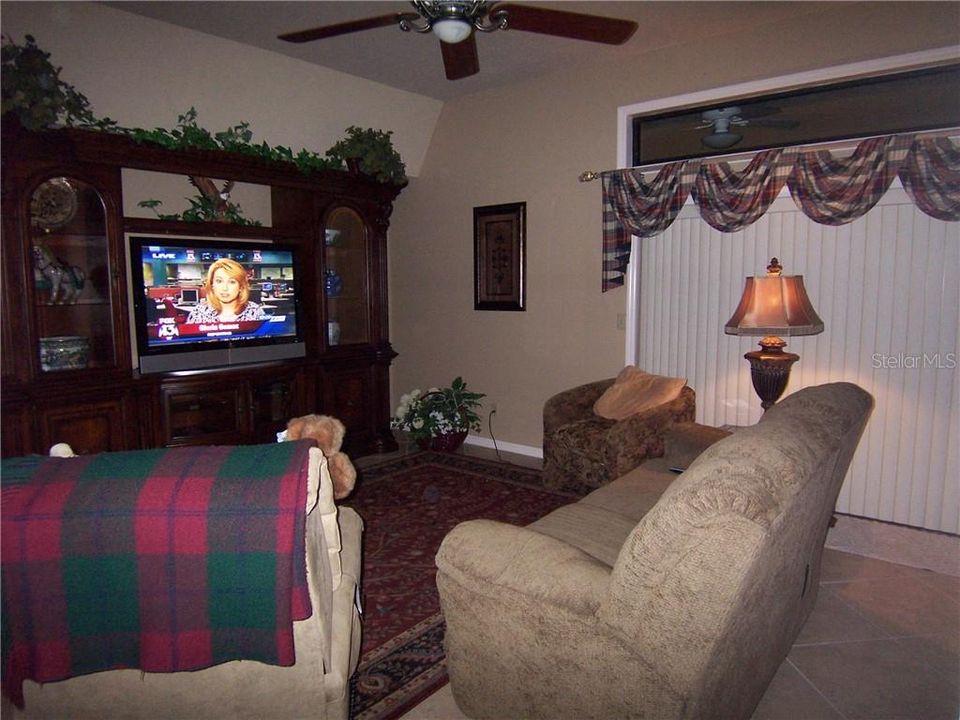 FAMILY ROOM - verticals have been removed and replaced with a more modern privacy selection.