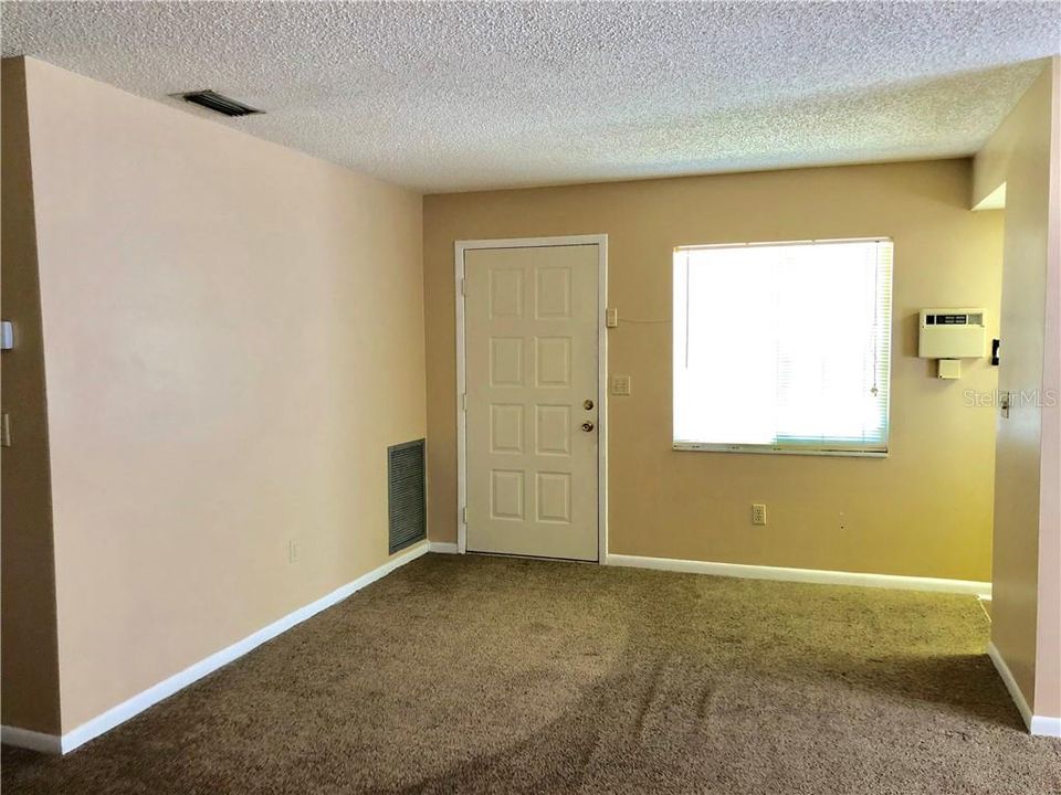 Living Room with door to small balcony