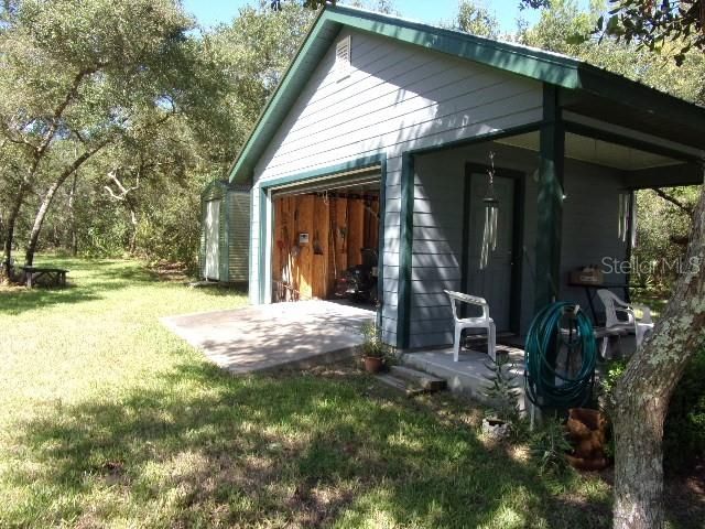 Large door for driving ATVs, mowers, etc. inside building