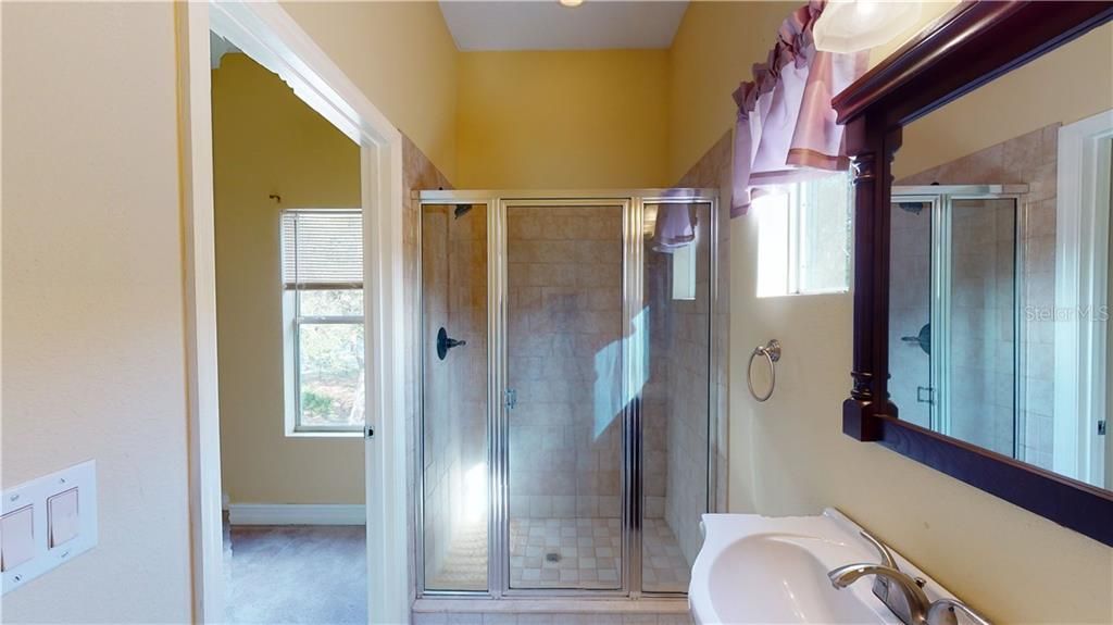 Bathroom #4 with walk in tile shower and tons of natural light.