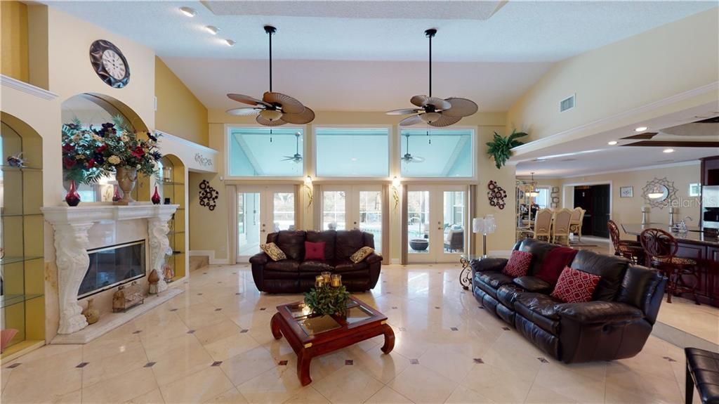 This room was made for entertaining with it's open floor plan and three set of french doors that leads to your outdoor oasis.