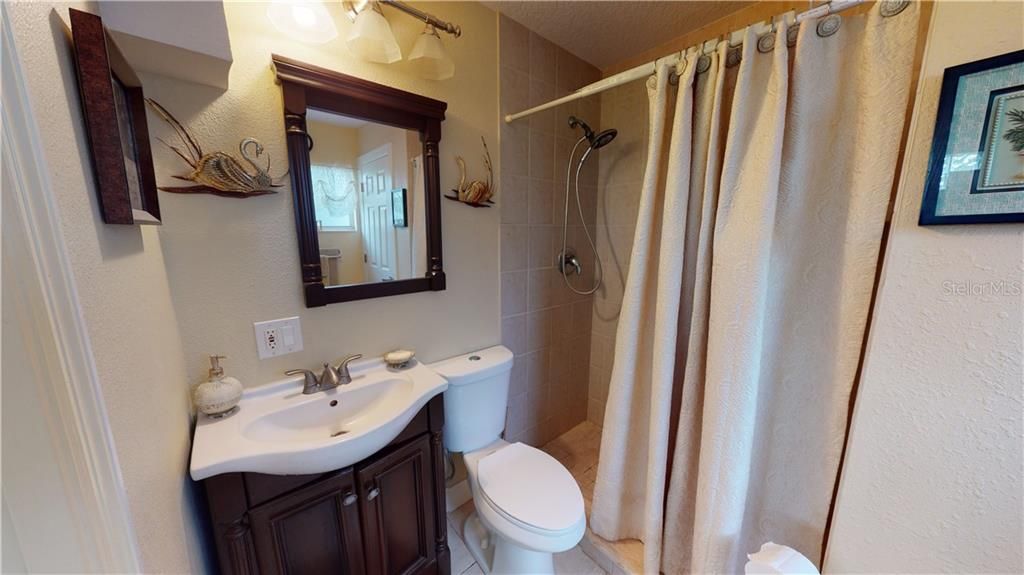 Guest room bath with walk in shower.