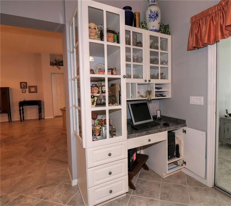 Built in desk and storage cabinet in the kitchen is beautiful.
