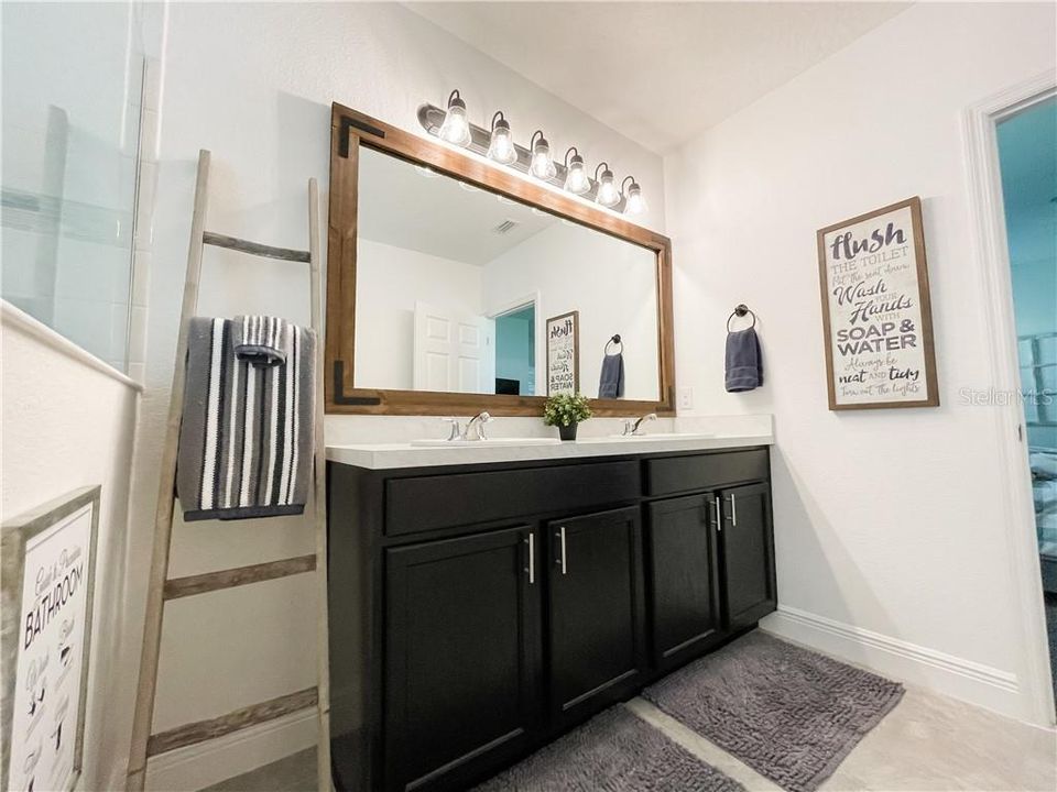 Double Sinks in Master Bathroom PLUS walk in shower with decorative tile