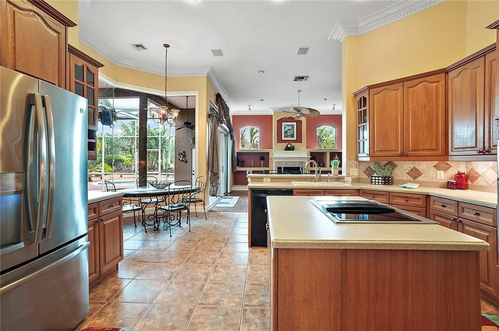 Center Island with Cooktop and Custom Cabinets