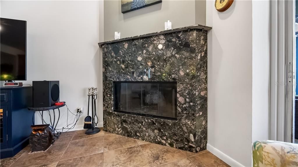 Marble Surround Wood Burning Fireplace in Family Room